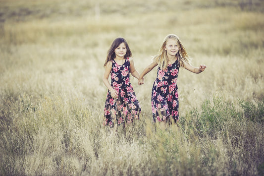 two girls playing in the fields