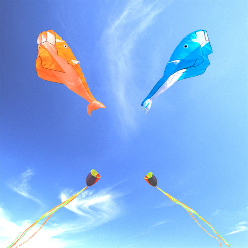 Orange and Blue Dolphin Kites flying different directions