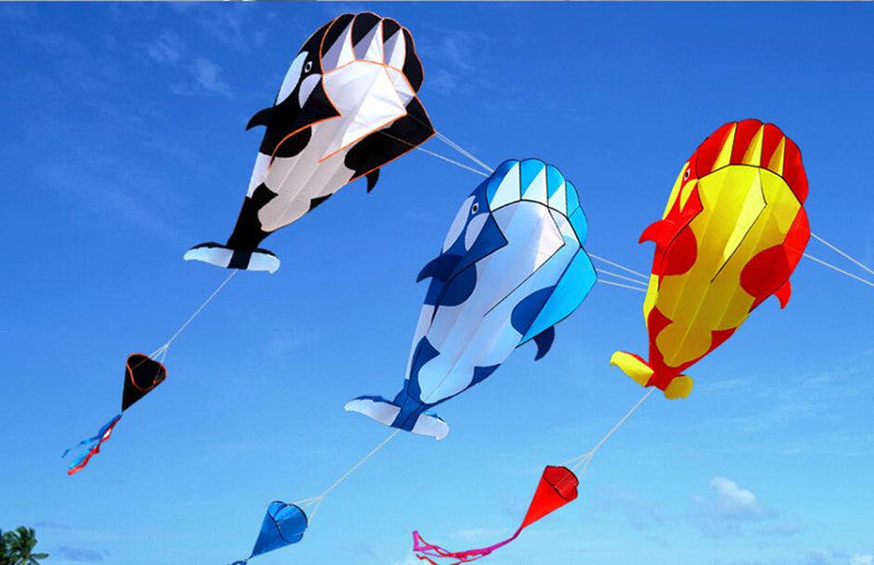 White and Black, White and Blue, Red and Yellow Dolphin Kite in the Sky
