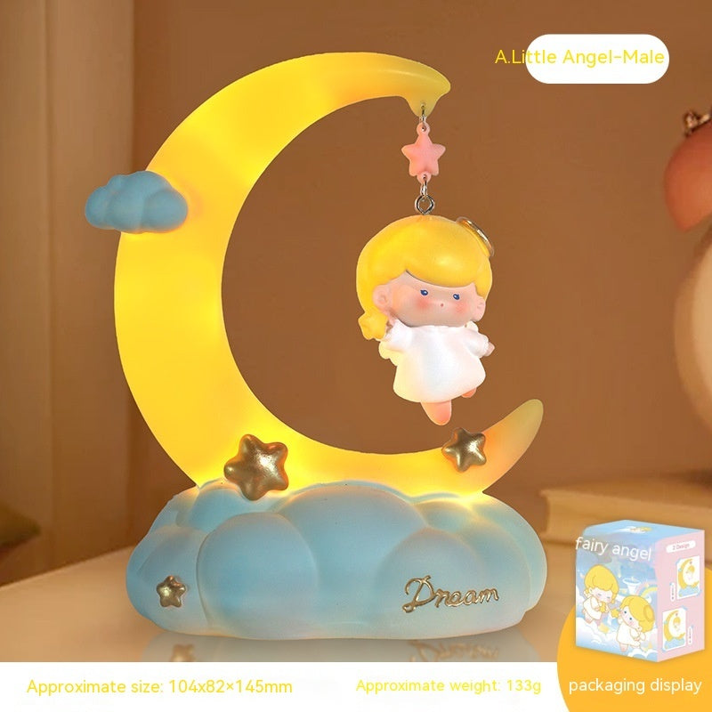 Moon shaped bedside lamp with little angel