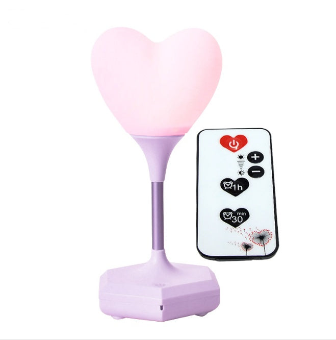 pink heart shaped night lamp with purple base and remote