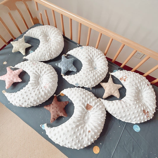 5 Baby Velvet Comforter Shaped Pillow Toys in a cot