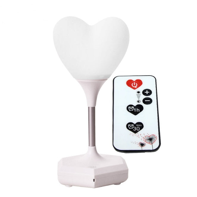 white heart shaped night lamp with white base and remote