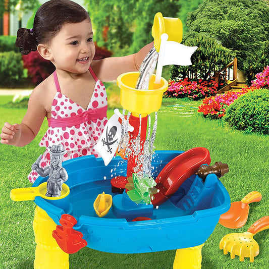 A child playing with Pirate Ship Sand & Water Play Table