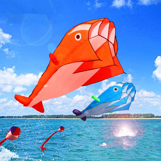 Red and Blue Dolphin Kites Jumping out of water