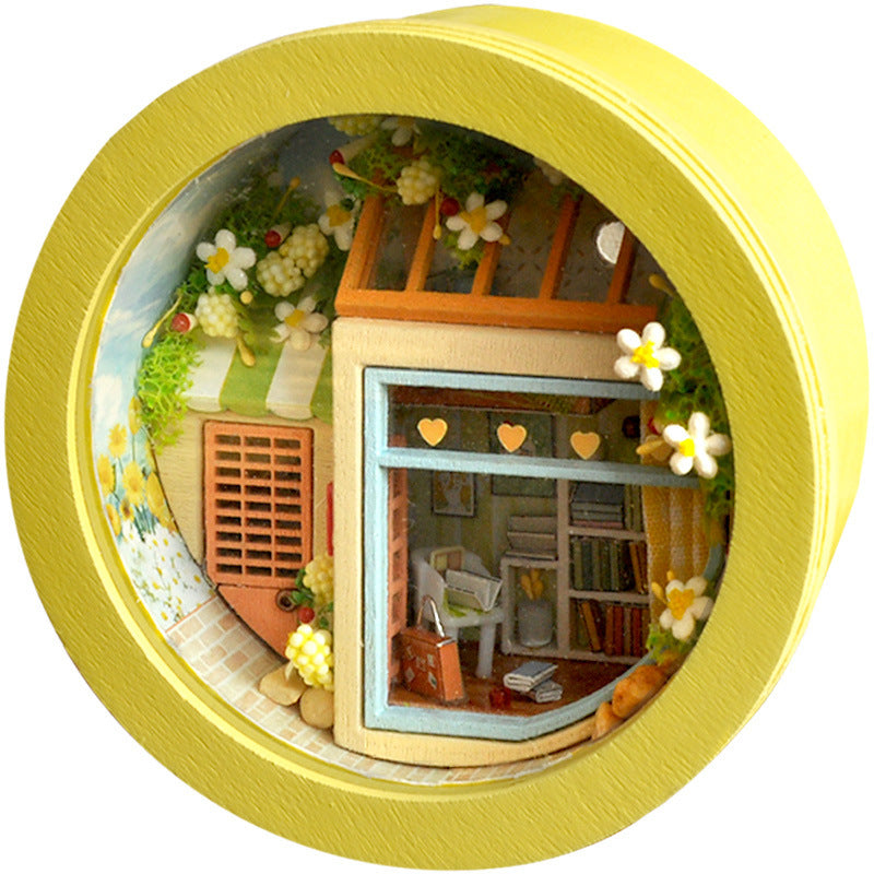 Yellow  Assembling a Small House Model Creative Handmade Toy on a white background