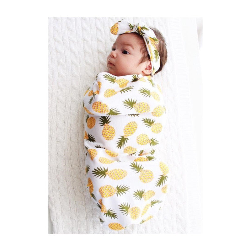 baby wrapped in Pineapple Baby blanket