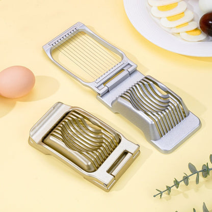 grey open and gold closed egg cutters