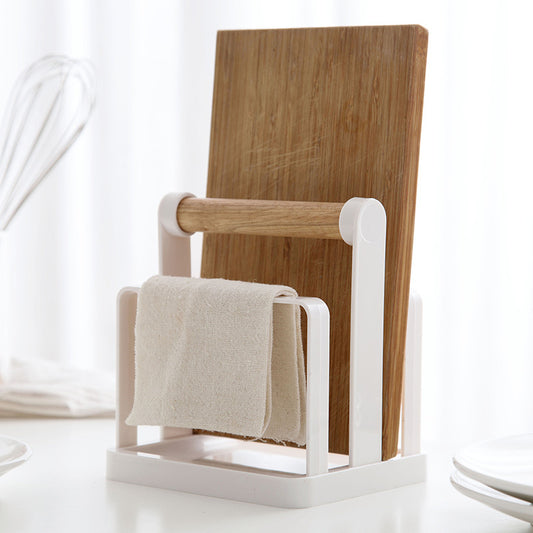 kitchen storage rack with cutting board and towel