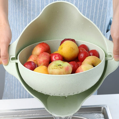 light green strainer with apples in it