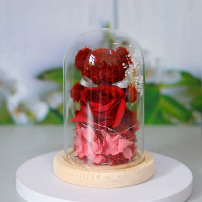 red preserved rose and teddy bear