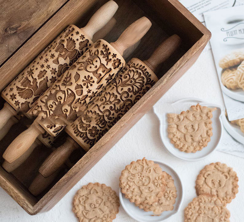 three rolling pins in a box